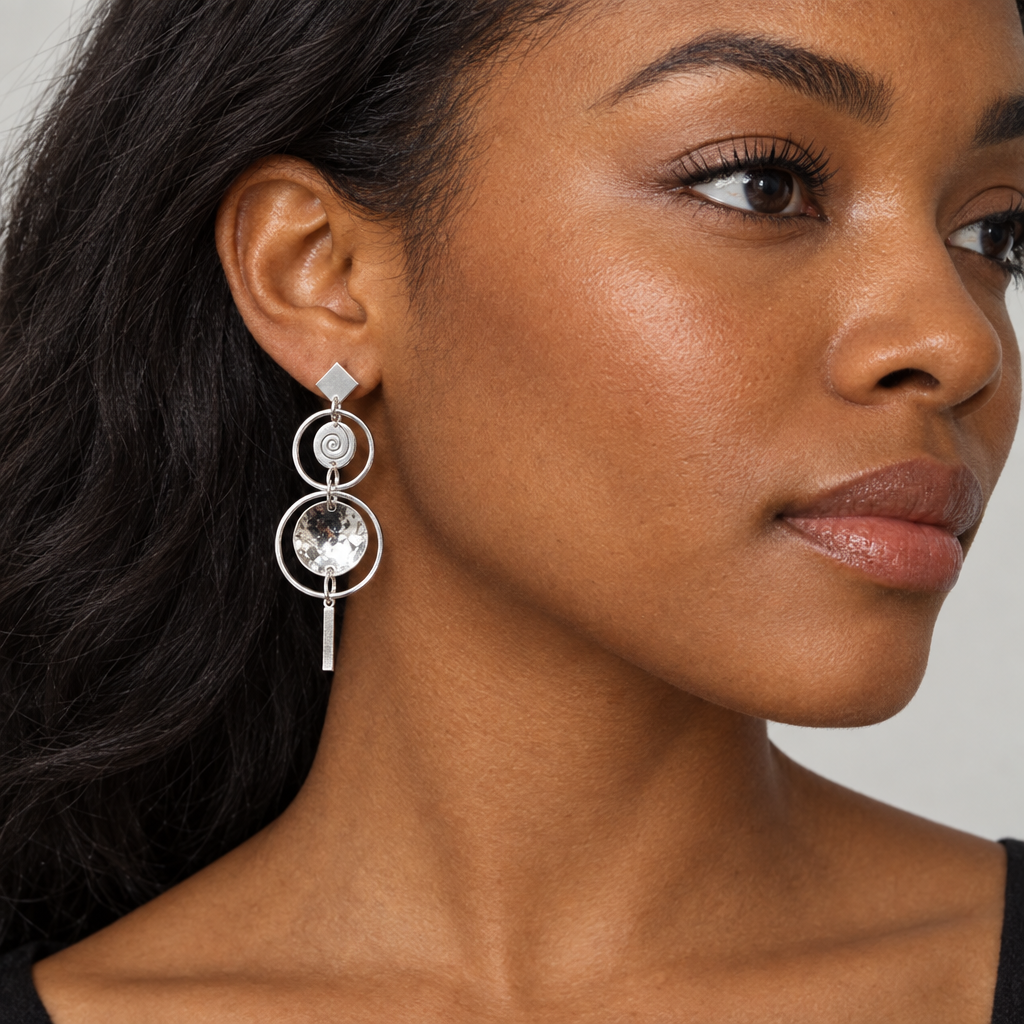 Black model wearing the layered silver drop earring