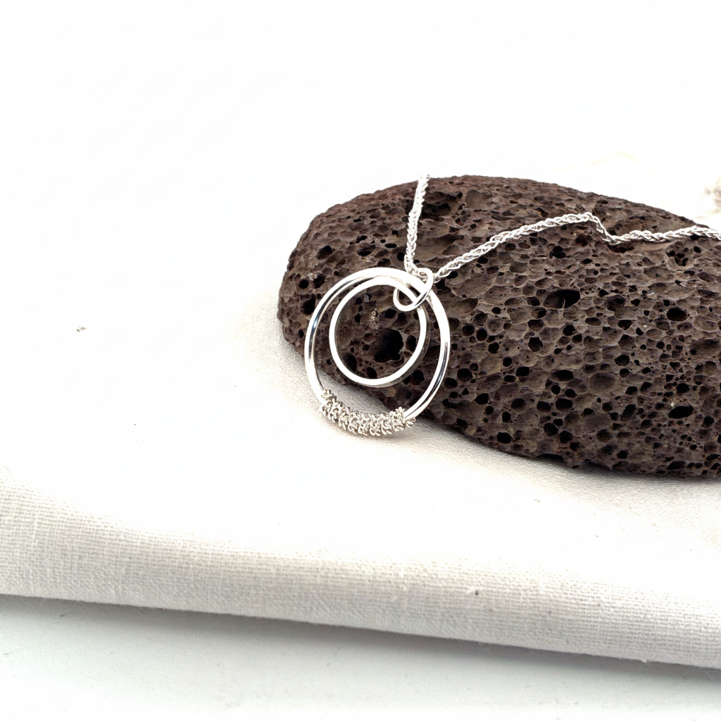 Chain Wrapped Double Ring - product on rock