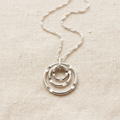 Cornered Ring Pendant on ivory linen