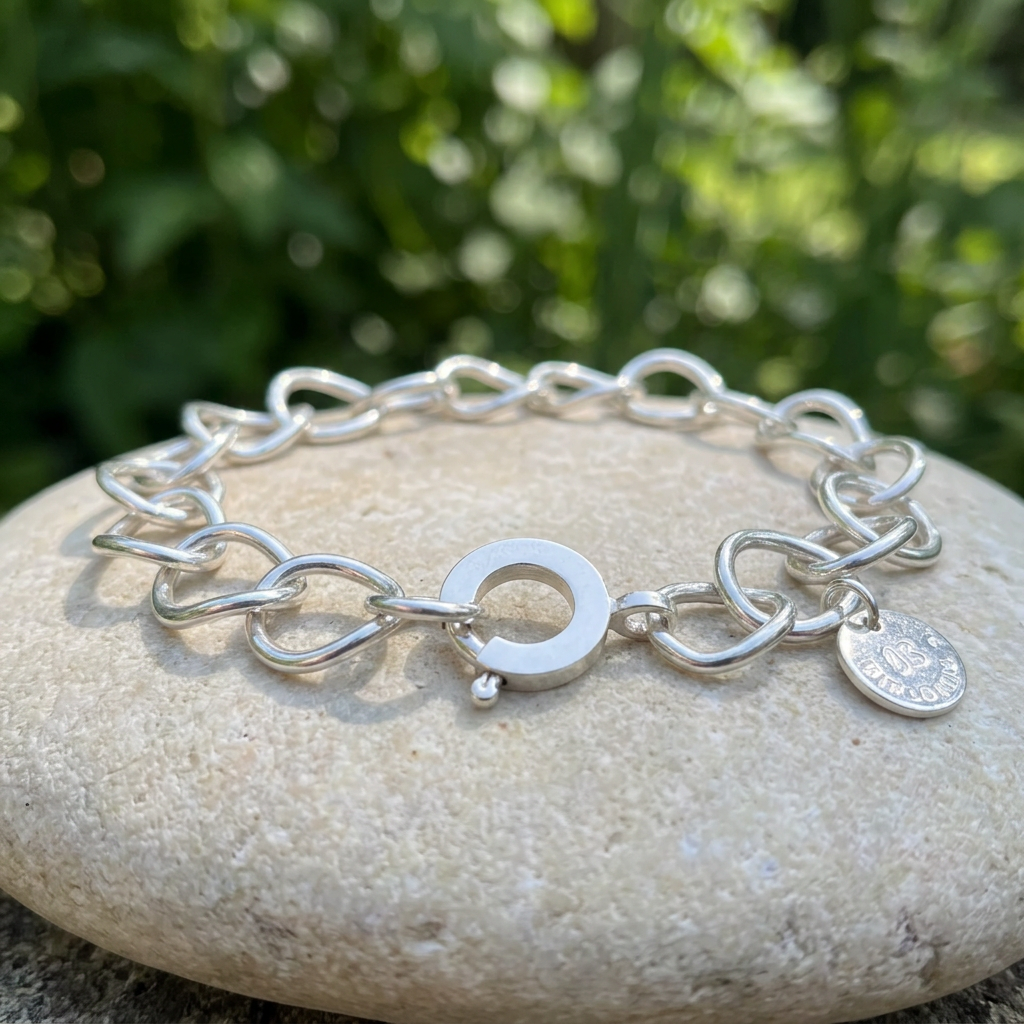 Curved Link bracelet outdoors from a low side angle