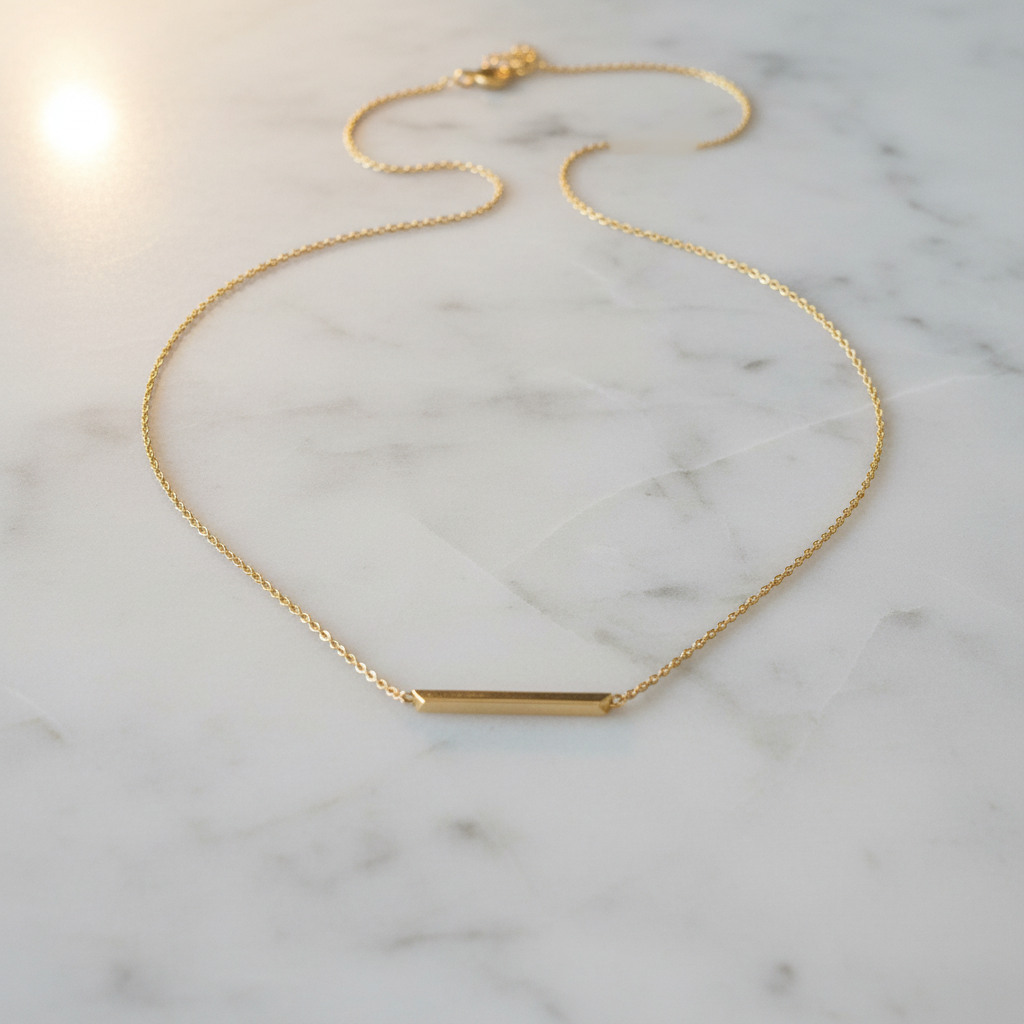 Gold horizontal bar pendant indoor flat lay corrected