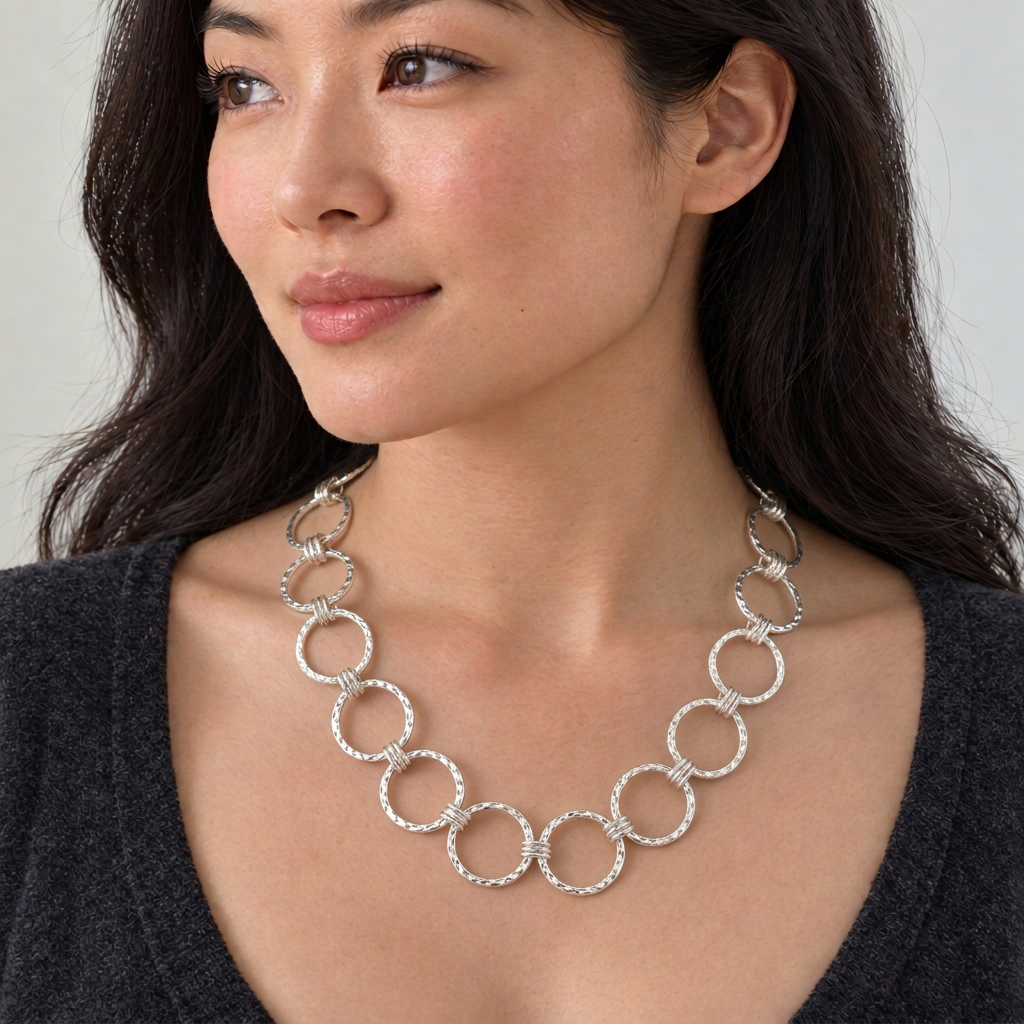 Necklace with further reduced circle sizes, retaining hammered texture and triple connectors