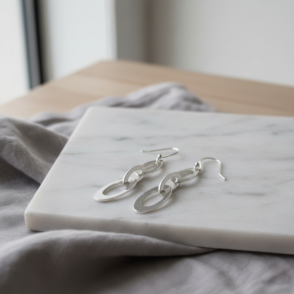 Oval Chain Sterling Silver Earrings on indoor surface