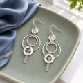 Revised earrings on a ceramic tray
