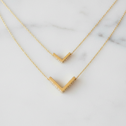 Small and large gold chevron pendants size comparison
