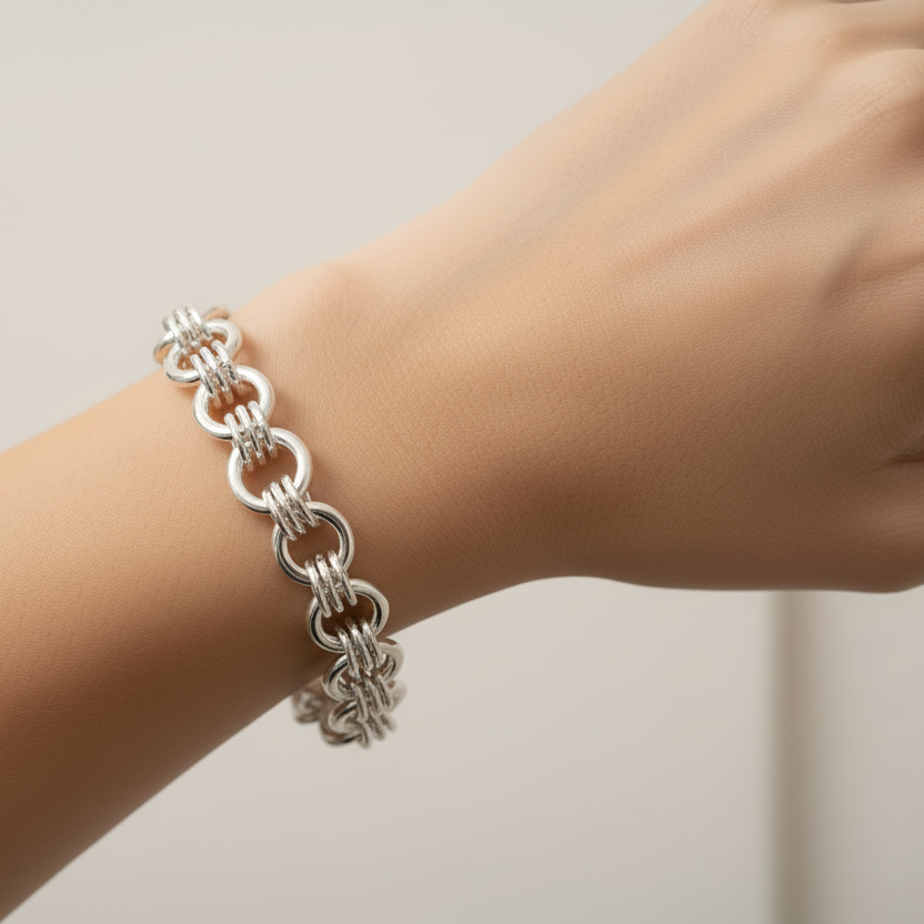 Woman wearing Chunky Triple Link Sterling Silver Bracelet without clasp visible