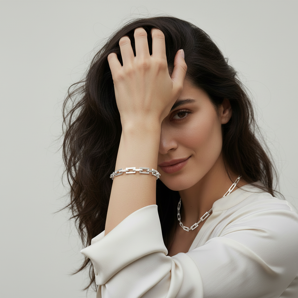 Woman with hand in hair wearing Chunky Rectangular Chain Necklace and bracelet - square
